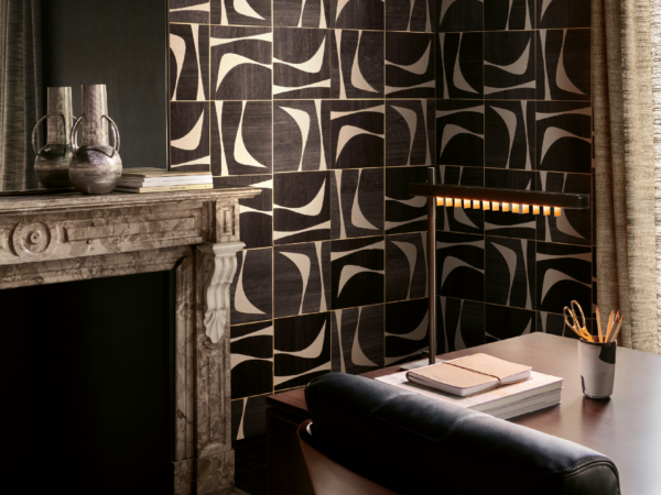 Handcrafted paper and wood marquetry — an echo of the crescent moon. 